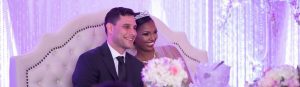 Smiling bride and groom at the sweetheart table. Astoria Banquets is one of Best of wedding venues in Chicago and suburbs.